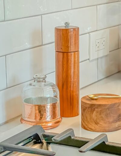 Close-up of white subway tile backsplash and wooden kitchen accessories in Rosemont kitchen remodel